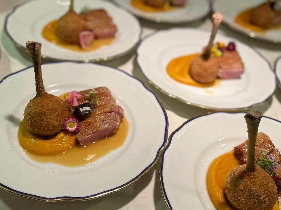 A plated main course from La Pizzica's catering